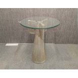 An aviator style aluminium covered rocket tale side table with bevelled round glass top, H. 77cm,