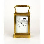 A gilt brass striking carriage clock, H. 18cm. Understood to be in working order.