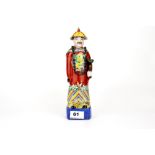 A Chinese hand painted porcelain figure of a Mandarin holding a Ruyi, H. 27cm.