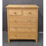 A contemporary wooden chest of drawers with two starfish handles, 94cm x 81cm x 43cm.