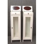 A pair of paint finished glass door bathroom cabinets with drawer and mirror lid hinged top, 126cm x