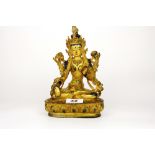 A Tibetan gilt bronze and hand painted figure of a seated Tara, H. 20.5cm.