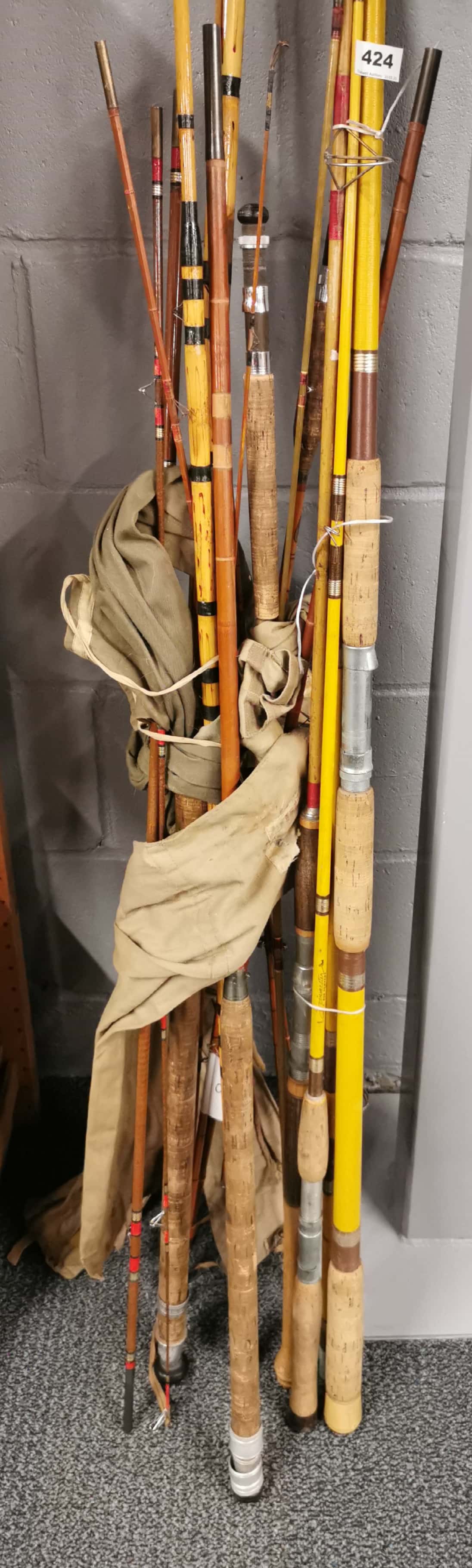 A collection of vintage fishing rods. - Image 2 of 2
