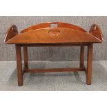 A reproduction mahogany butlers tray and stand, 60cm x 88cm x 56cm.