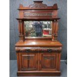 An Art Nouveau carved mahogany mirror backed dresser, W. 122cm, H. 202cm.