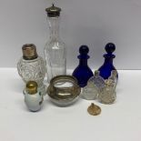 A small group of cut glass and other perfume bottles etc. with a hallmarked silver mounted bowl.