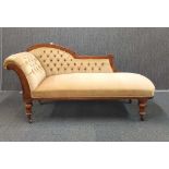 A Victorian carved mahogany chaise longue, H. 88cm, L. 181cm, D. 59cm.