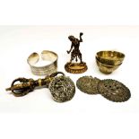 A group of Tibetan bronze and white metal items, figure H. 8cm.