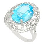 A 925 silver ring set with an oval cut blue topaz and white stones, L. 2.4cm, (Q.5).