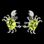 A pair of 925 silver crab shaped earrings set with oval cut peridots, L. 1cm.