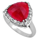 A 925 silver ring set with faceted cut ruby and white topaz, (R.5).