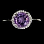 A matching 925 silver ring set with round cut amethyst and white stones, (P).