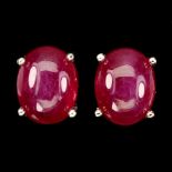 A pair of 925 silver stud earrings set with cabochon cut rubies, L. 0.8cm.