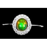 A 925 silver cluster ring set with a cabochon cut opal and white stones, (K).