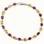 A 925 silver bracelet set with oval cut garnets and citrines, L. 18cm.