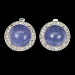 A pair of 925 silver earrings set with cabochon cut tanzanites and white stones, L. 1.2cm.