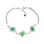 A 925 silver bracelet set with oval cut emeralds and white stones, L. 19cm.