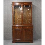 A mahogany veneered bookcase, 193 x 98cm.