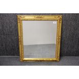 A gilt wood framed bevelled glass mirror, 63 x 72cm.
