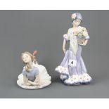 Two boxed Lladro porcelain figurines largest H. 25cm.