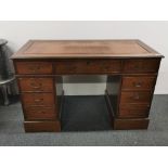 A leather topped wooden desk, 120 x 60 x 75cm.