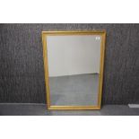 A gilt wood framed bevelled glass mirror, 96 x 67cm.