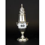 A hallmarked silver sugar shaker, H. 16cm.