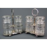 Two silver plated stands with cut glass pickle jars, damage to one stopper, H. stand H. 23cm.
