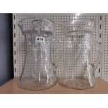 Two large vintage glass lemonade jugs, one with centre ice container, H. 30cm.