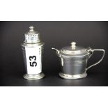 A hallmarked silver mustard pot with blue glass liner together with a hallmarked silver pepper shake