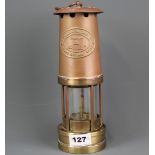 An E. Thomas and Williams Ltd miners lamp, H. 25cm.