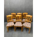 A set of six country pine dining chairs.