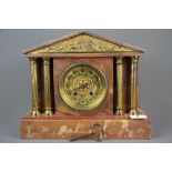 A 19th/ early 20th C pink marble and gilt mantle clock, H.27cm x W.32cm.
