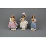 Three Lladro pottery figurines, tallest 21.5cm.