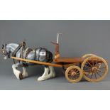 A porcelain shire horse and cart, L. 70cm.