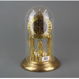 A gilt brass glass domed torsion pendulum clock, overall H. 28cm.