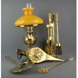 A brass electric lamp in an oil lamp style, H. 33cm, together with a companion set.