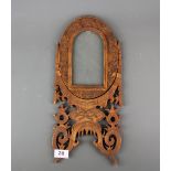 A 19th century oriental carved sandalwood rotating photo frame, L. 41cm.