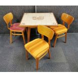 A vintage tiled top kitchen table H. 72cm. with three chairs and a nest of two tile top tables.