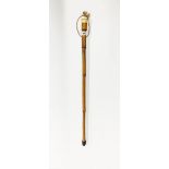 A 19th century ivory topped walking stick with rose metal mounts (tested gold), L. 84cm.