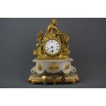 A 19th century French gilt metal and alabaster clock raised on a gilt wooden pedestal, H. 36cm (with