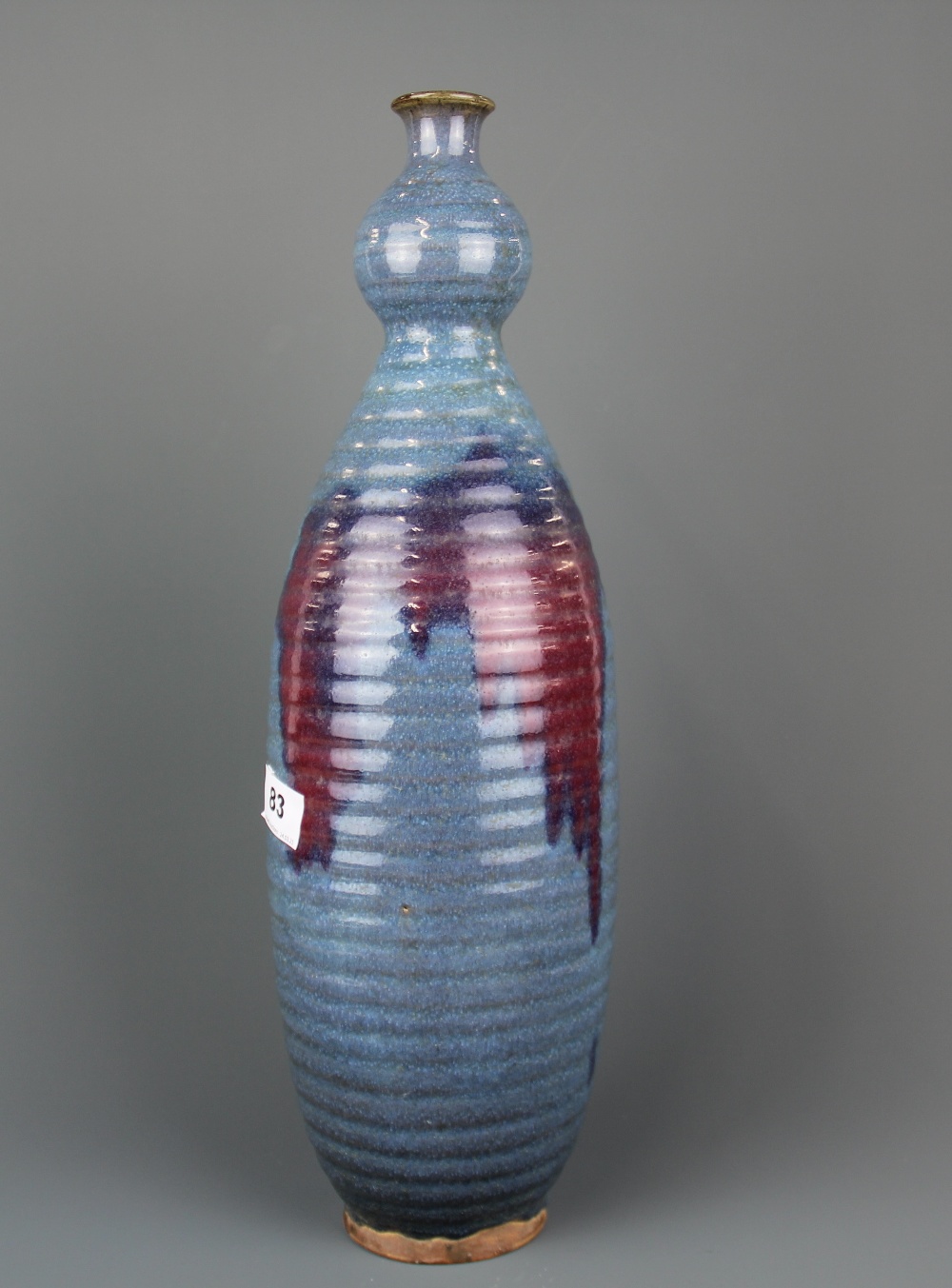 An unusual Chinese Zhun glazed pottery vase with ribbed and splashed decoration, H. 45cm.