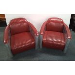 A pair of superb red upholstered aluminium aviator armchairs, 73cm x 83cm x 106cm.