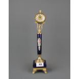 A German gilt metal decorative clock, H. 34cm.
