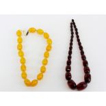 An old facetted reconstituted cherry amber necklace with a faux butterscotch amber necklace.