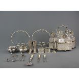 A group of silver plated items and six bottle cruet on a silver plated stand, tallest 20cm.