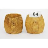 A pair of carved wooden Robert Thompson Mouseman napkin rings, H. 5cm Dia. 4.5cm.