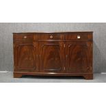 A mahogany veneered sideboard, L. 145cm, W. 37cm.