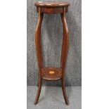 An inlaid Edwardian mahogany plant stand, Dia. 30cm. H. 93cm.