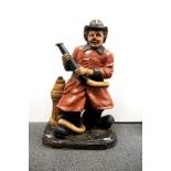 A composition figure of a clown fireman, H. 73cm.